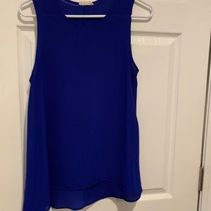 royal blue flowy tank longer in back than front